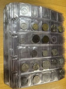 World, Mixed Countries, Album with a collection of 610 mostly different world coins in nice grades including a collection of Dutch coins with many silver items...